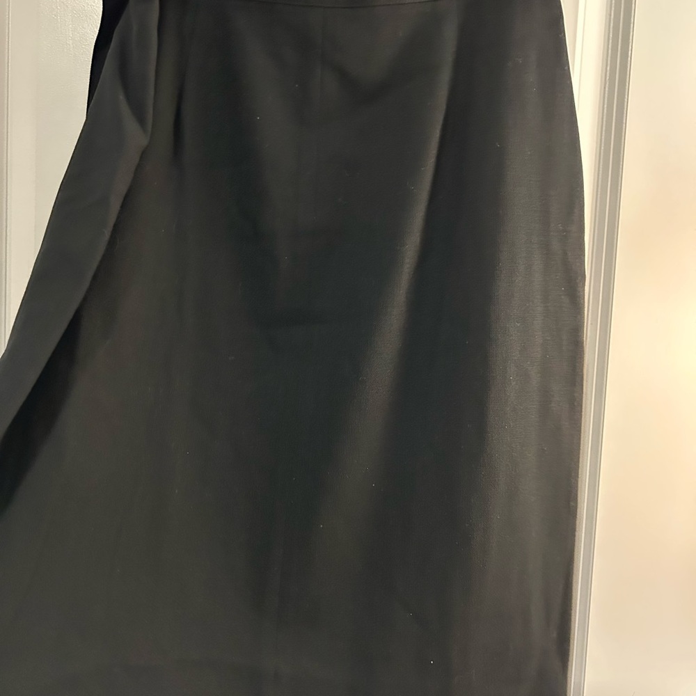 Ladies black knee length bi fold skirt lined with three front side pleats